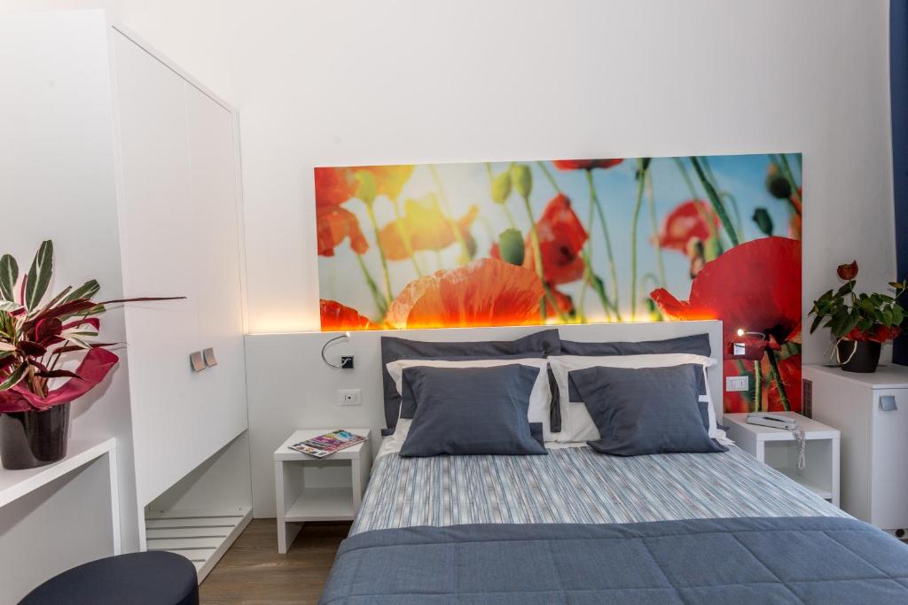 Posteľ alebo postele v izbe v ubytovaní Hotel Wally