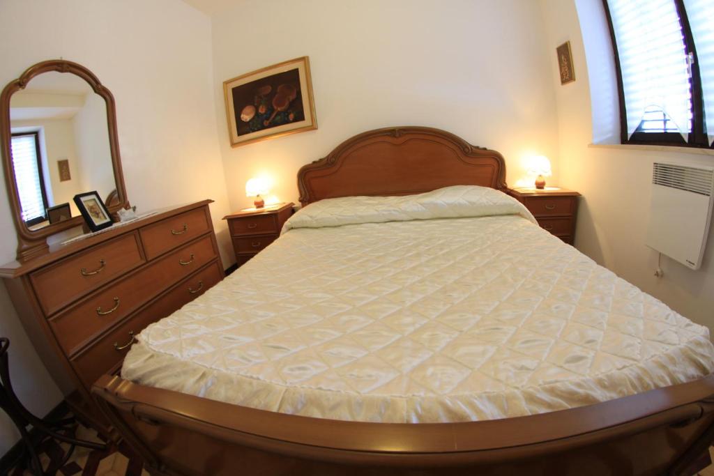 Postel nebo postele na pokoji v ubytování Apartments Butinar Pri Kapitanu