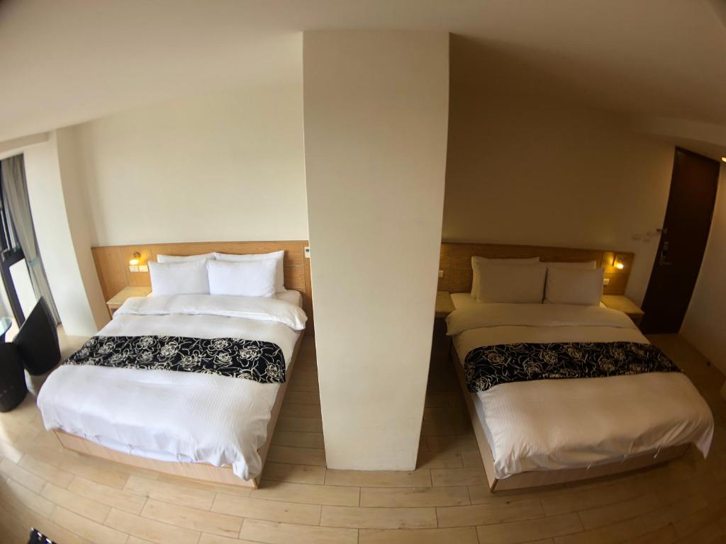 Ming Yue Hu Hotel - Vierbettzimmer