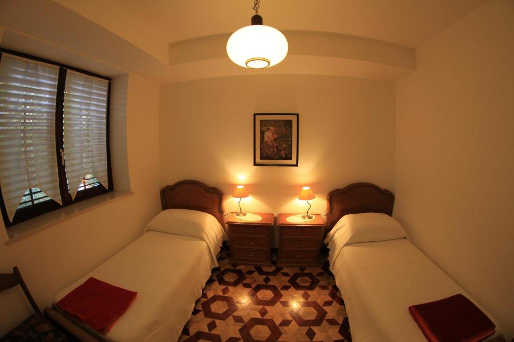 Postel nebo postele na pokoji v ubytování Apartments Butinar Pri Kapitanu