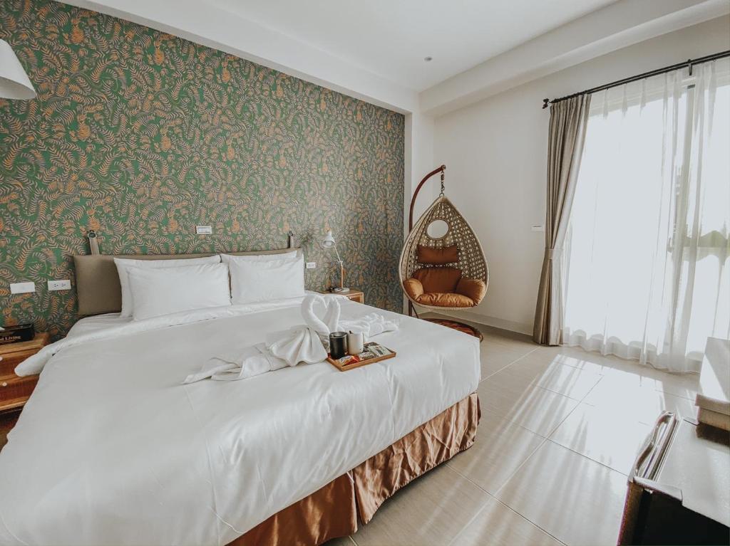 Postel nebo postele na pokoji v ubytování 禾旅宿Ho Hostel 墾丁夢幻島