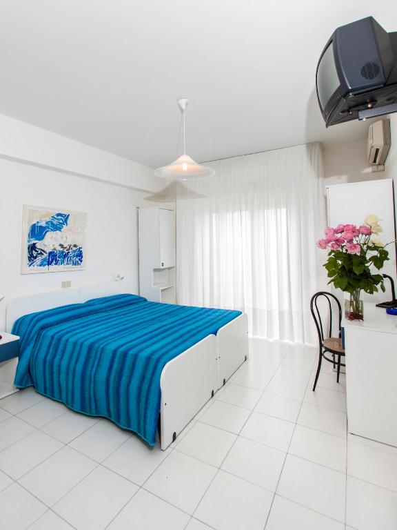 Posteľ alebo postele v izbe v ubytovaní Hotel Wally
