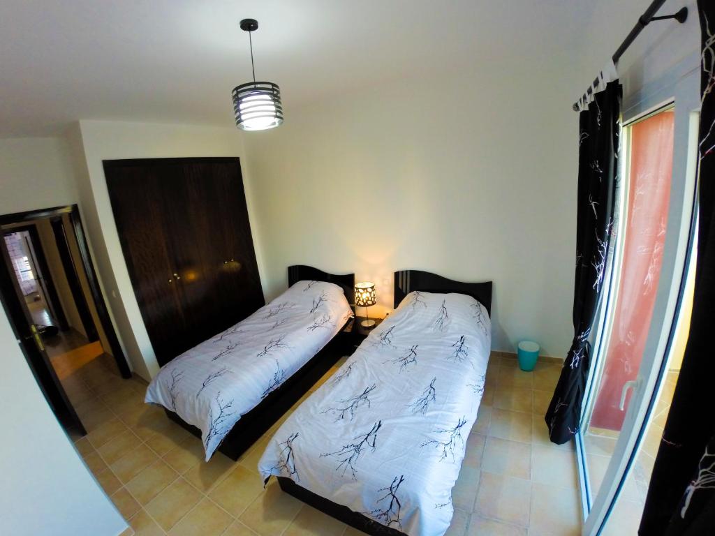 Postel nebo postele na pokoji v ubytování Appartement Résidence Alwaha Saidia