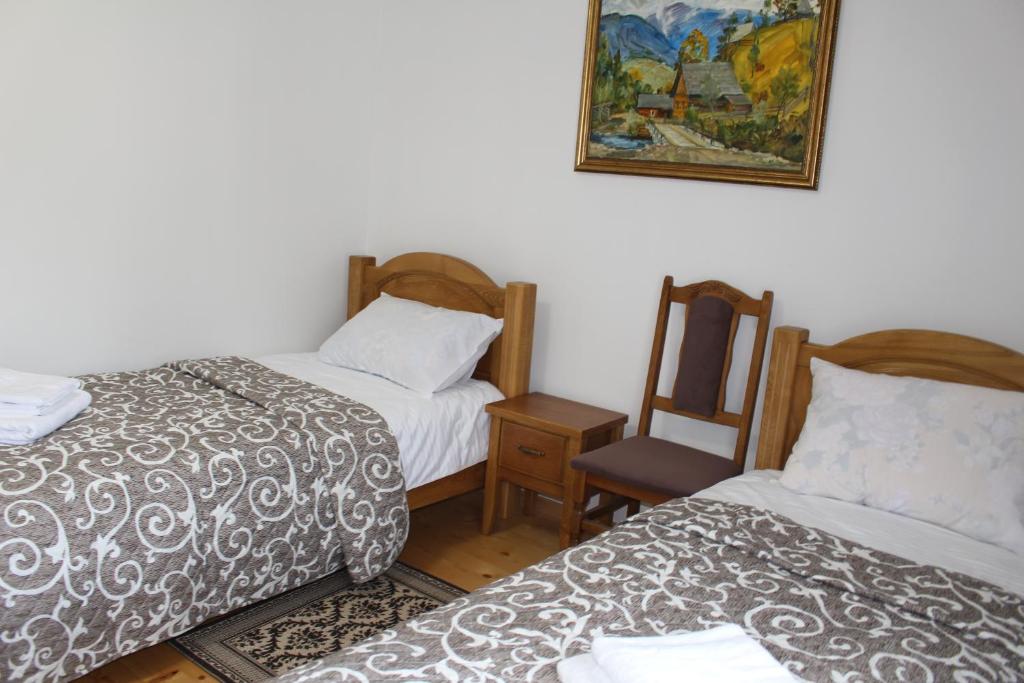 Postel nebo postele na pokoji v ubytování Kolochava Hotel & Restaurant