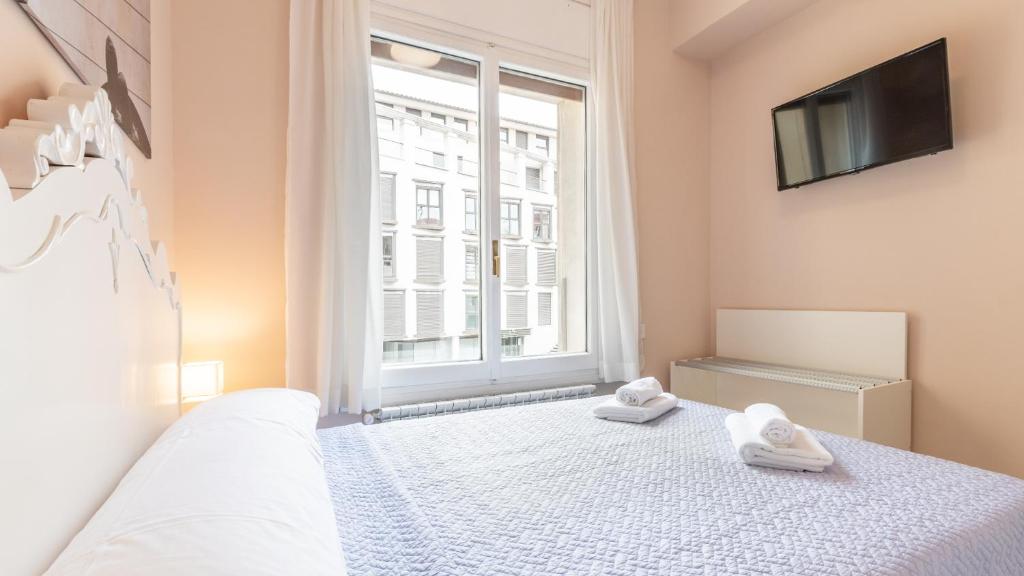 Postel nebo postele na pokoji v ubytování Balcon del Torico