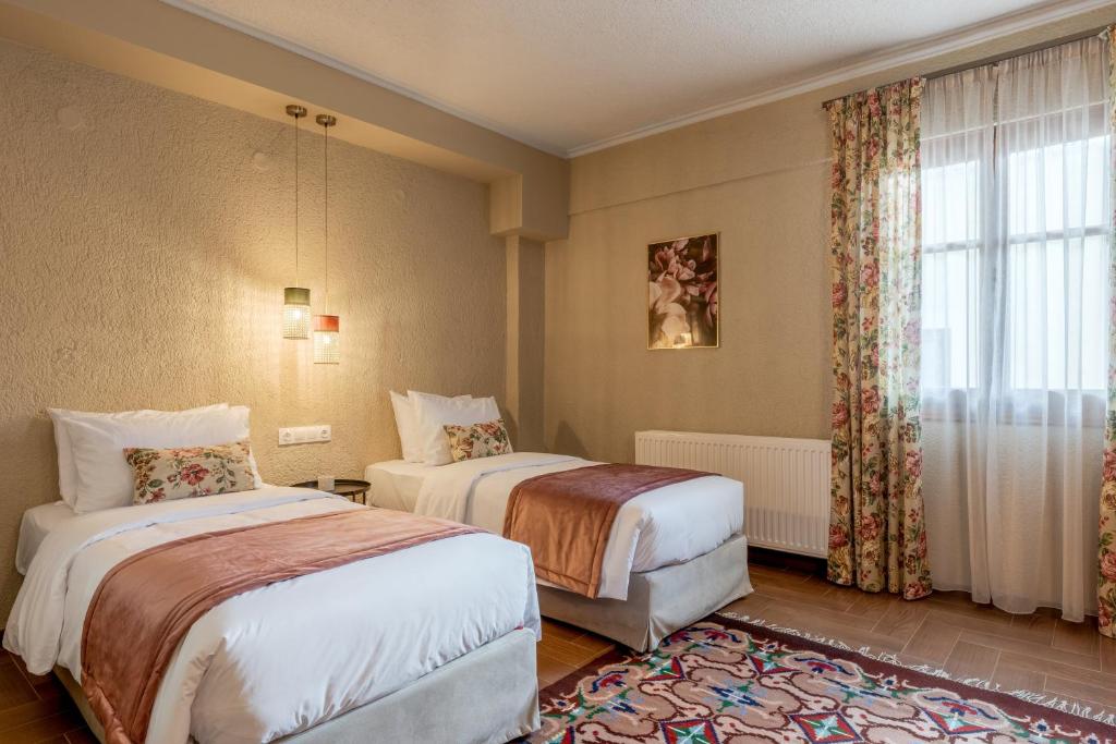 Postel nebo postele na pokoji v ubytování Paeonia Arachova