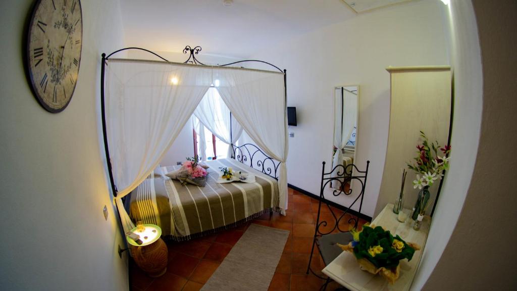 Postel nebo postele na pokoji v ubytování Rooms and Breakfast da Carla
