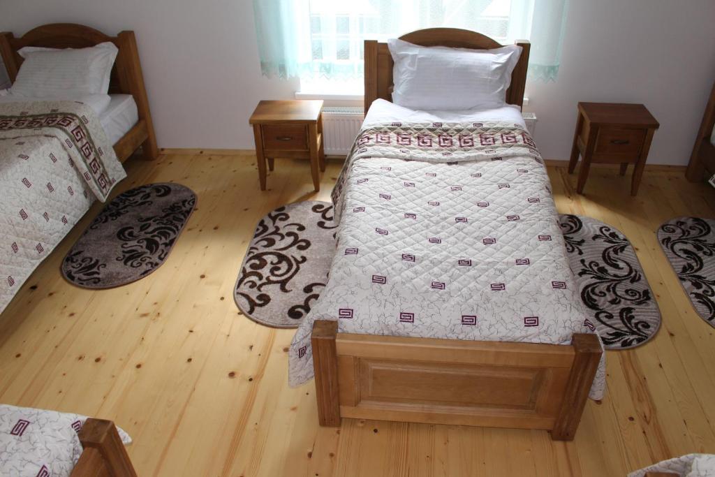 Postel nebo postele na pokoji v ubytování Kolochava Hotel & Restaurant