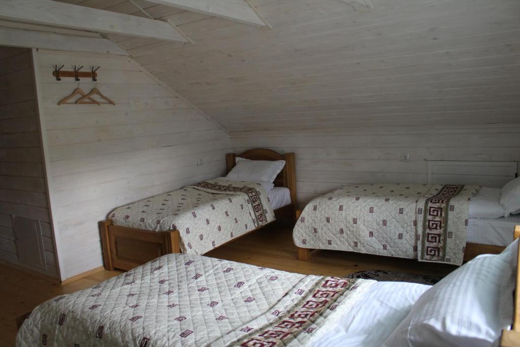 Postel nebo postele na pokoji v ubytování Kolochava Hotel & Restaurant