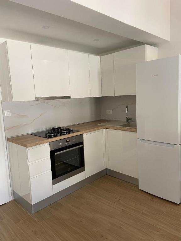 Kuchyň nebo kuchyňský kout v ubytování Apartmani Jolanda