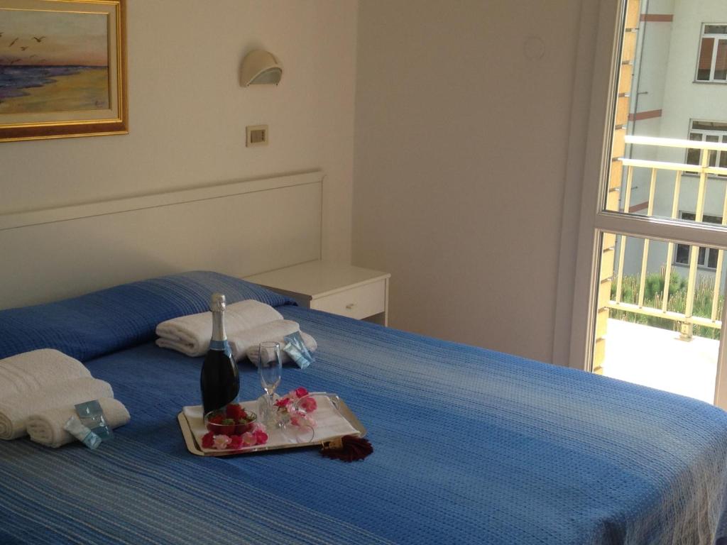 Postel nebo postele na pokoji v ubytování Hotel Primula