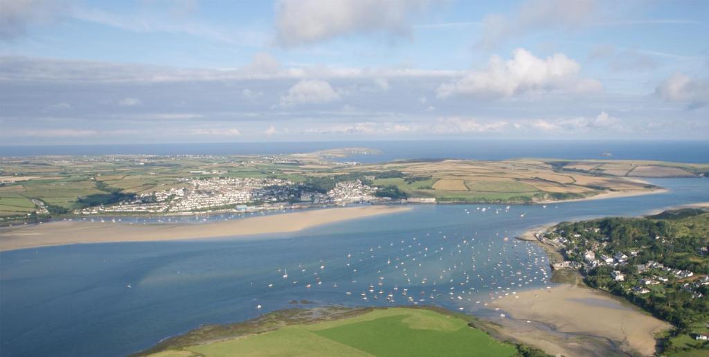 an aerial view of a harbor with boats in the water at Edge of Padstow, 2 bedroom luxury lodge in Padstow