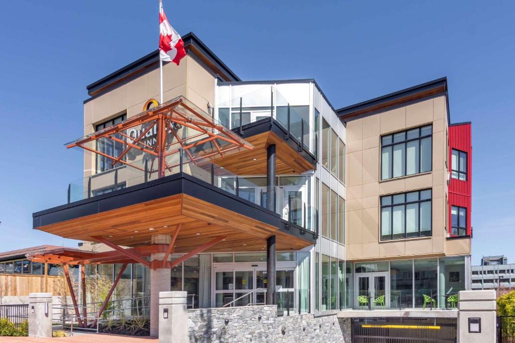 a building with a balcony on top of it at Quality Inn in Nanaimo