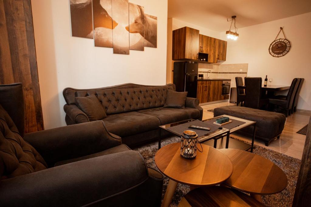 a living room with a couch and a table at Zlatar Apartman br 16 in Brdo