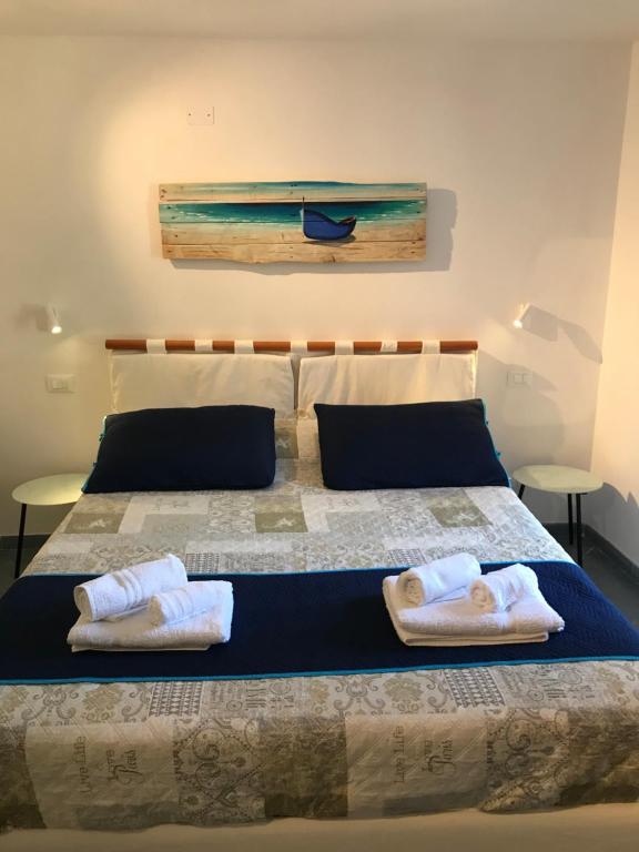Postel nebo postele na pokoji v ubytování Hannette Cinqueterre Apt Libeccio