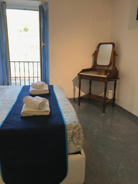 Postel nebo postele na pokoji v ubytování Hannette Cinqueterre Apt Libeccio