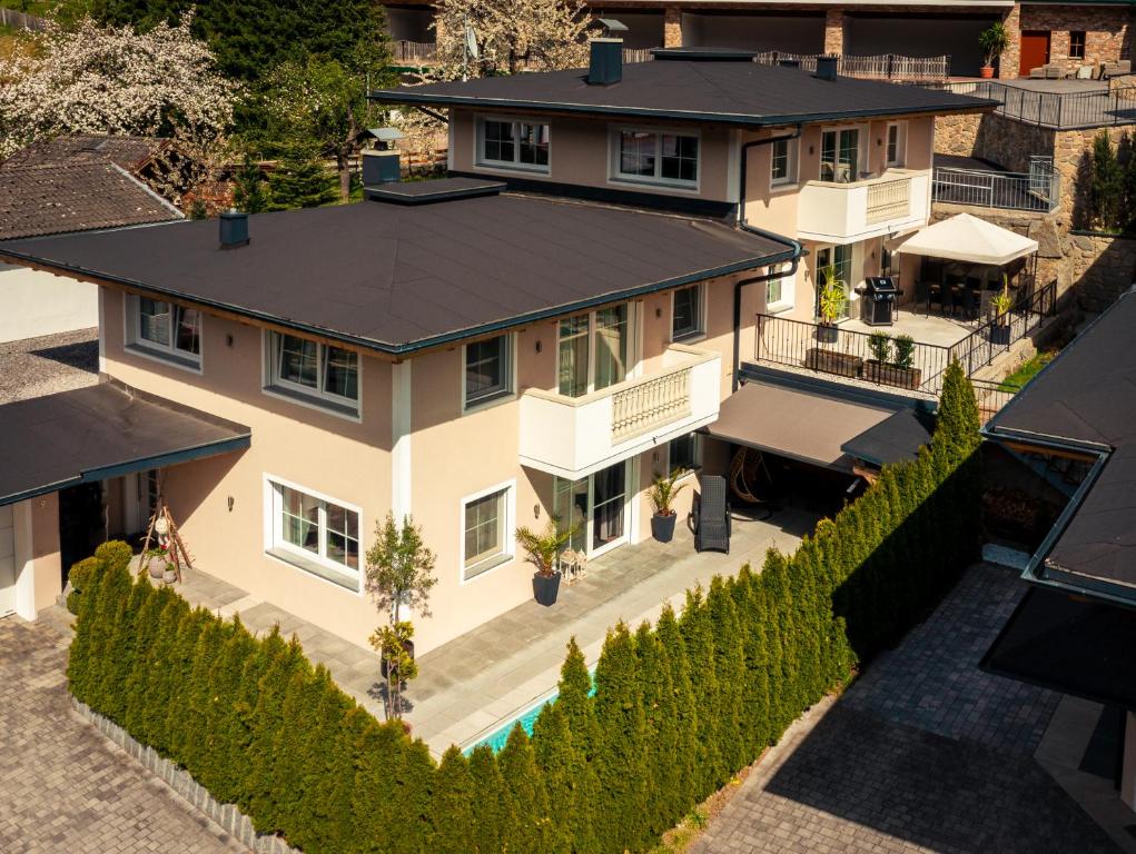 an aerial view of a house with a fence at Chalet Arena in Zell am Ziller