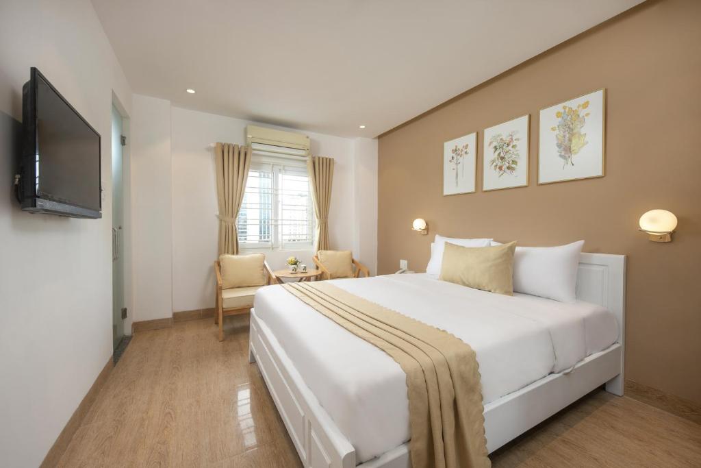 Cama o camas de una habitación en Nâng hạng phòng miễn phí - Amunra Hotel Đà Nẵng