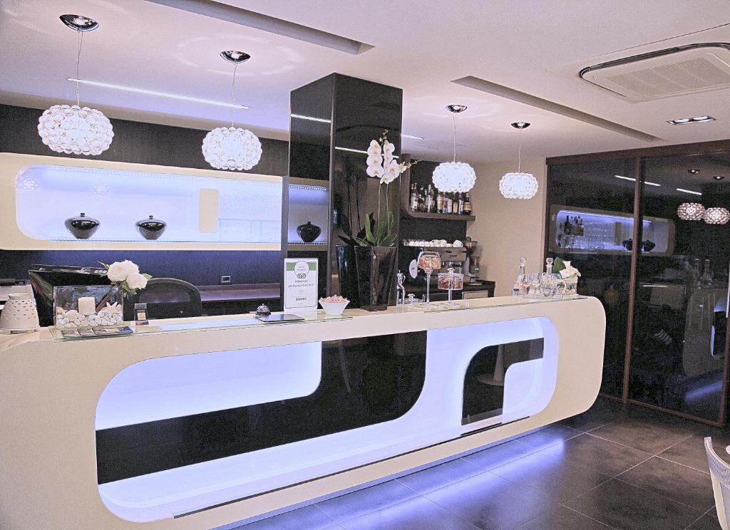 a store with a white counter in a room at Hotel Carla in Levanto