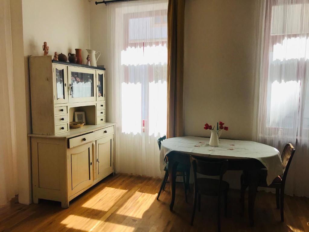 a kitchen with a table and a cabinet and a window at Dům Bublina in Veselí nad Moravou