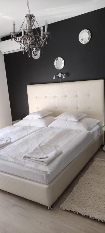 Postel nebo postele na pokoji v ubytování IKON apartman