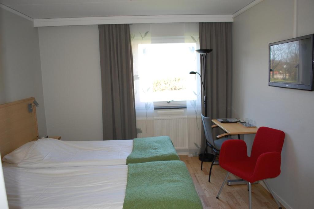 Postel nebo postele na pokoji v ubytování Allégården Kastlösa Hotell