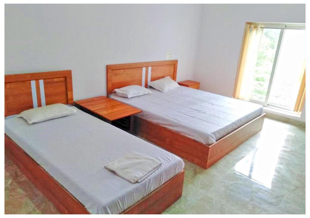 Postel nebo postele na pokoji v ubytování AYM Yoga Resort Arambol GOA