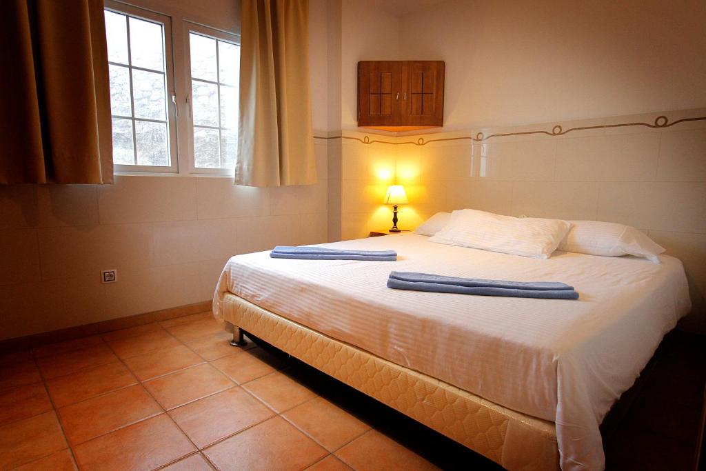 Posteľ alebo postele v izbe v ubytovaní Aparthotel Maracaibo
