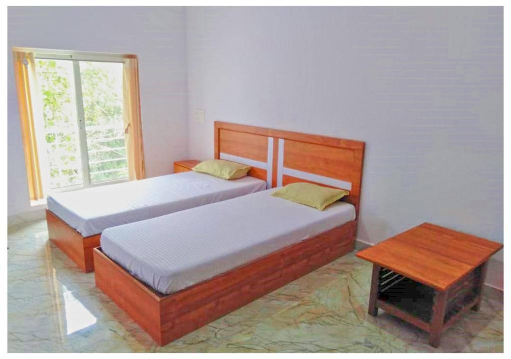 Postel nebo postele na pokoji v ubytování AYM Yoga Resort Arambol GOA