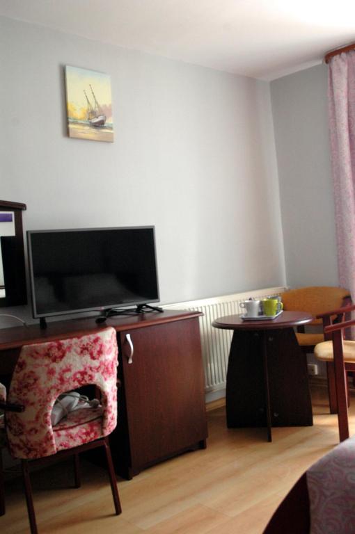 TV a/nebo společenská místnost v ubytování Słoneczne Tarasy