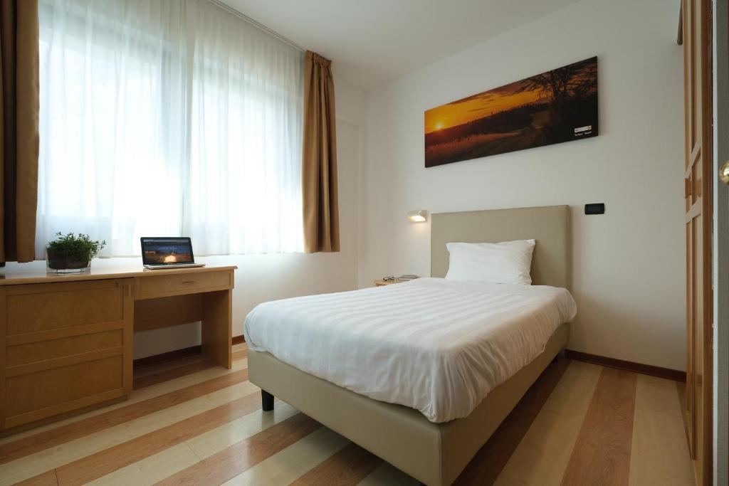 Posteľ alebo postele v izbe v ubytovaní Hotel Portavaldera