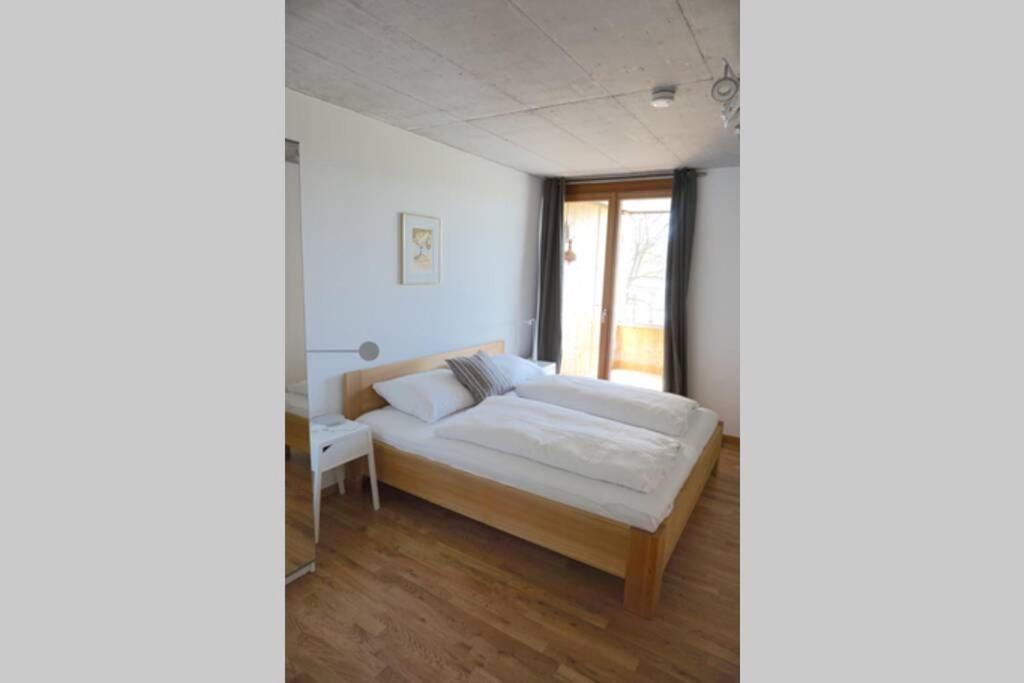 Postel nebo postele na pokoji v ubytování Terrassenwohnung in prämierter Wohnanlage