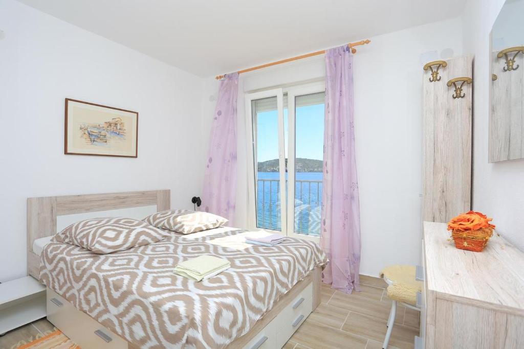 Posteľ alebo postele v izbe v ubytovaní Apartments Delfin