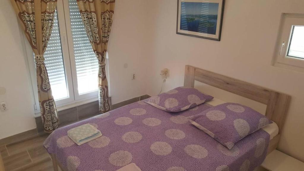 Posteľ alebo postele v izbe v ubytovaní Apartments Delfin