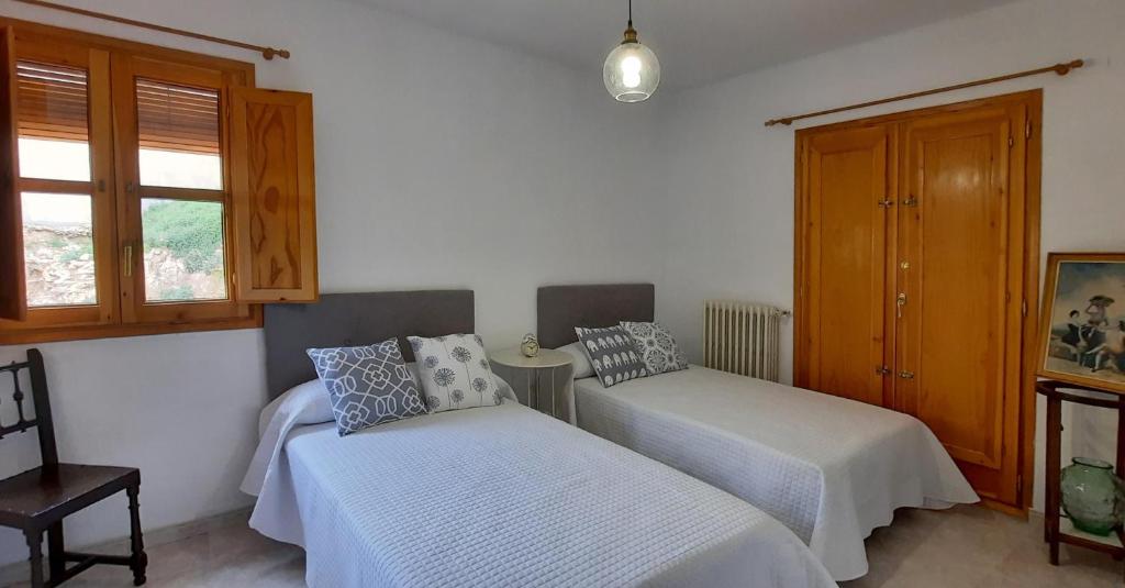 Postelja oz. postelje v sobi nastanitve VUT Casa Orrios, en el centro de Alcañiz.