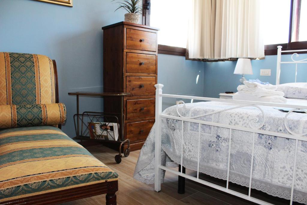 Łóżko lub łóżka w pokoju w obiekcie B&B Villa Lilla