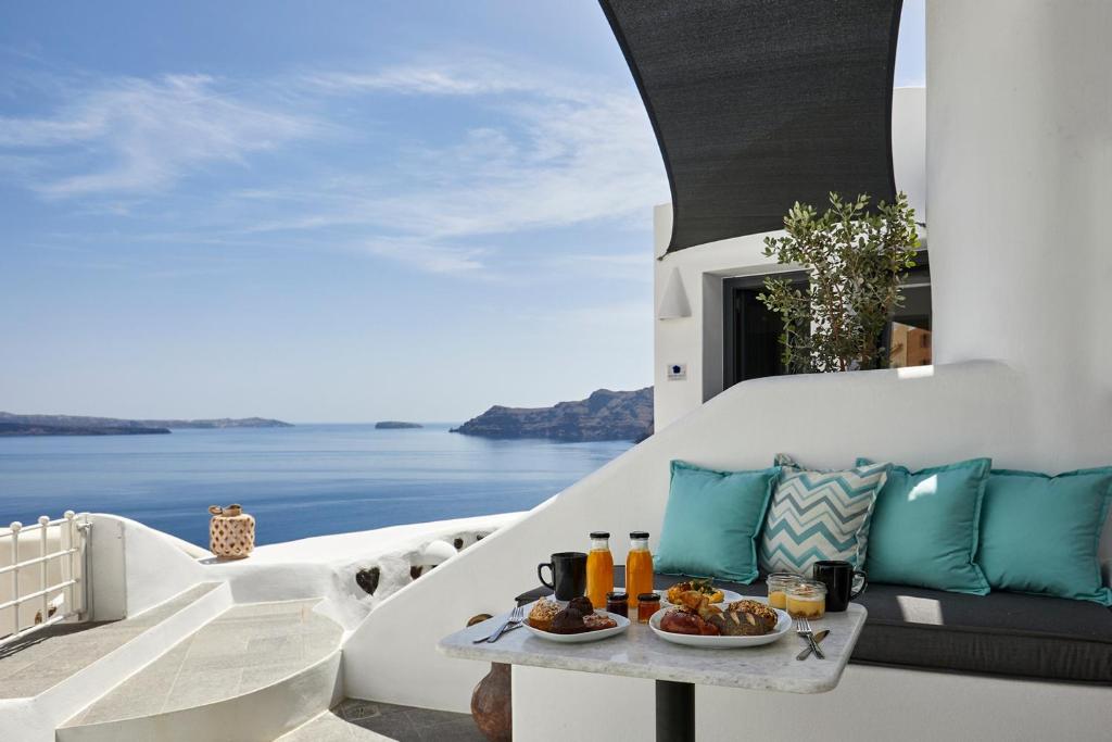a view of the ocean from a villa balcony at Blue Art Caves in Oia