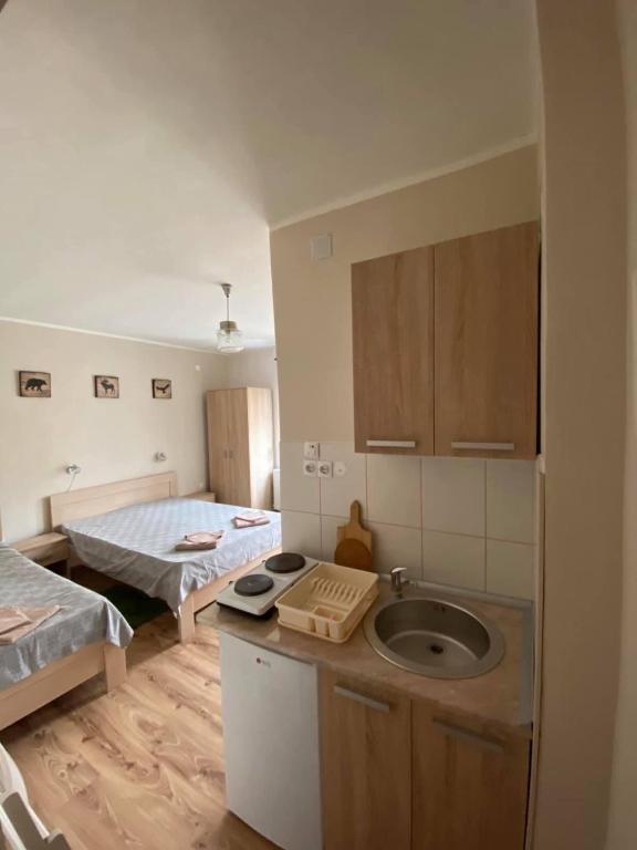 Postel nebo postele na pokoji v ubytování Ozrenska bašta apartmani