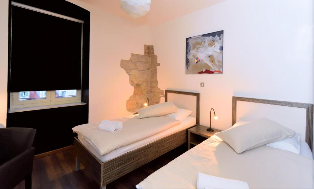 Postel nebo postele na pokoji v ubytování Marmontova Luxury Rooms