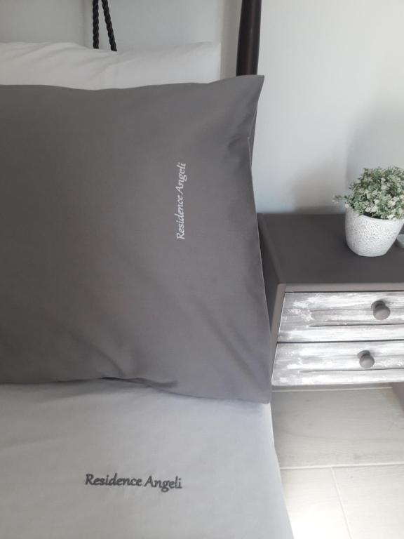 Postel nebo postele na pokoji v ubytování Residence Angeli