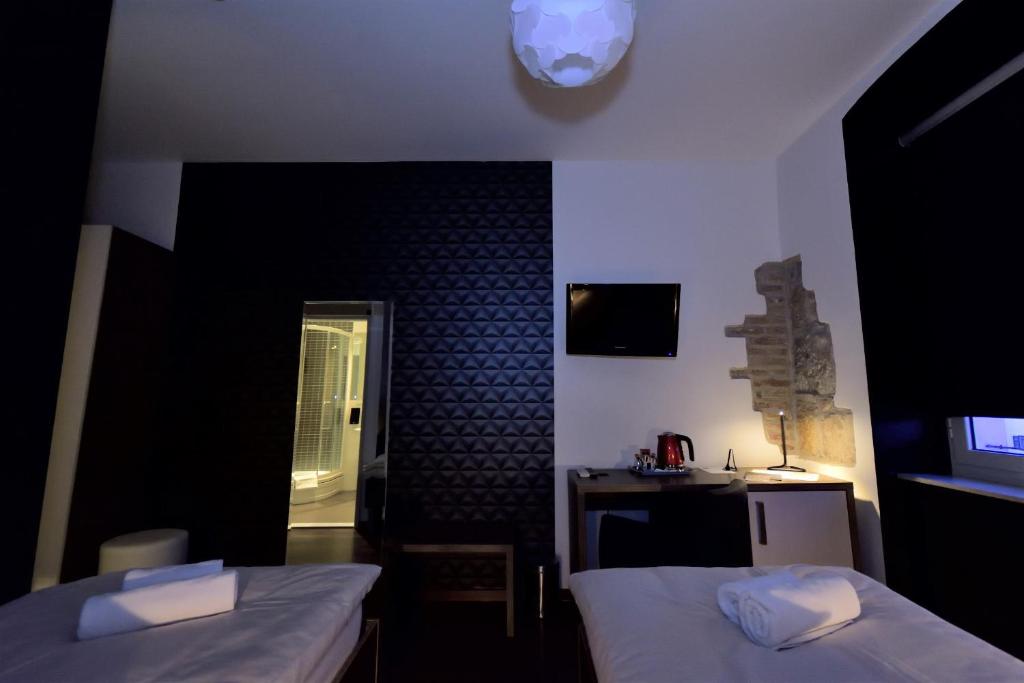 Postel nebo postele na pokoji v ubytování Marmontova Luxury Rooms