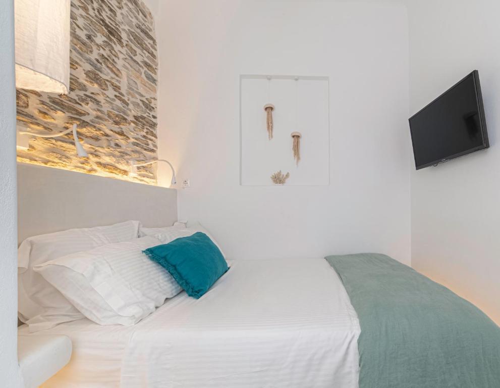 A bed or beds in a room at Lasia Boutique Apartment