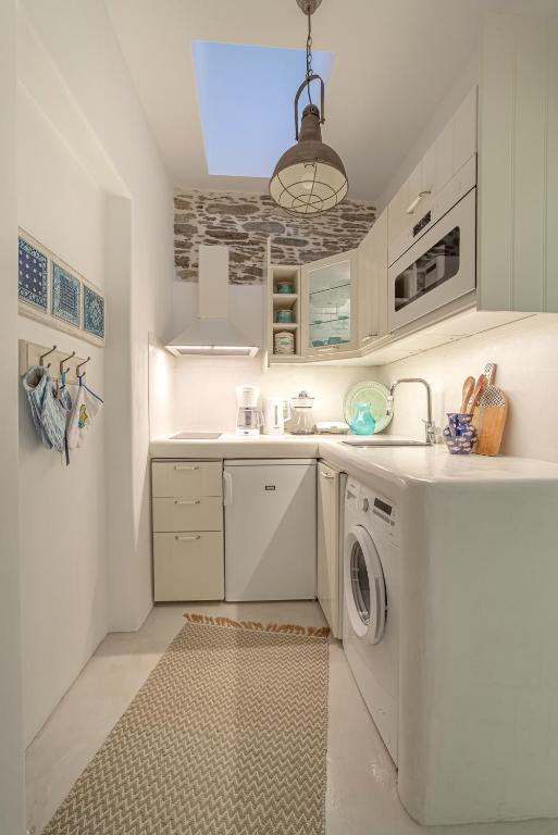 A kitchen or kitchenette at Lasia Boutique Apartment