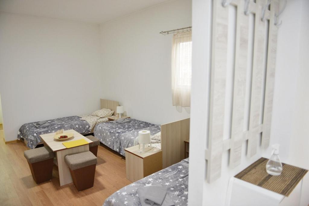 Postel nebo postele na pokoji v ubytování Apartman Martinovic