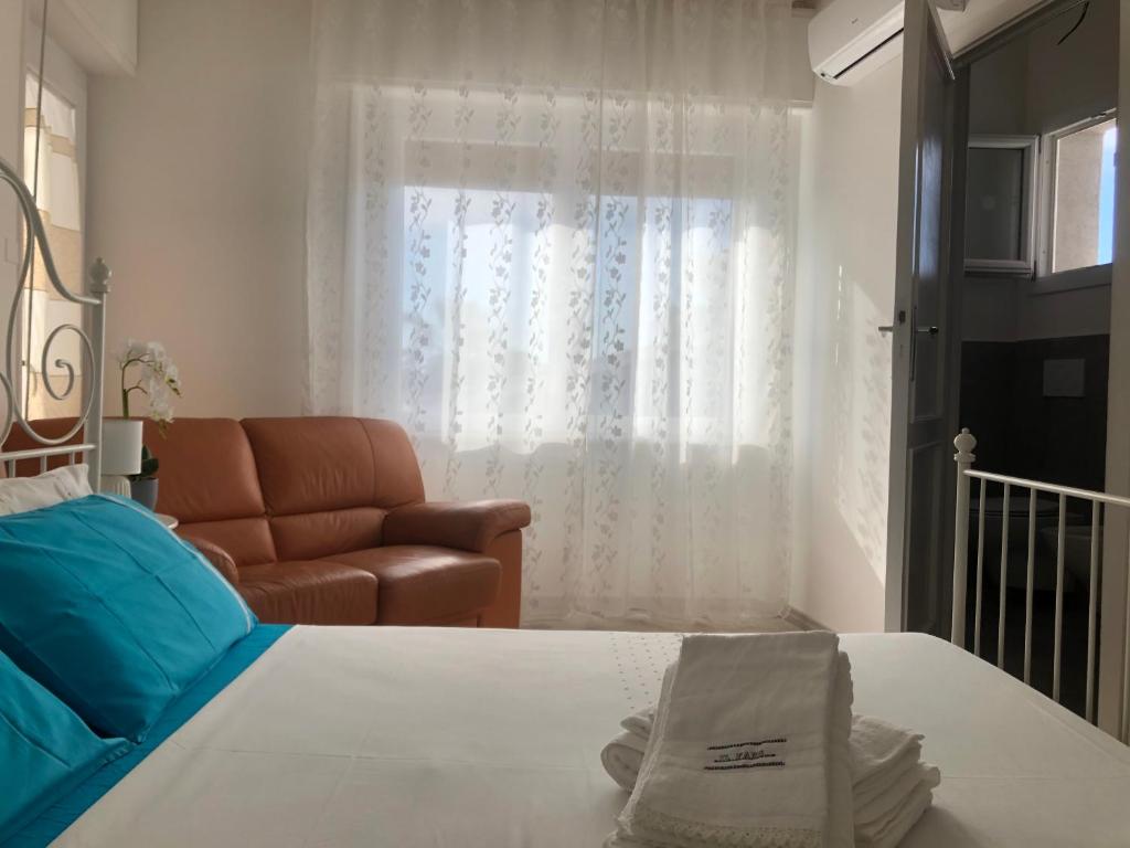 Postel nebo postele na pokoji v ubytování Il Faro di Alghero