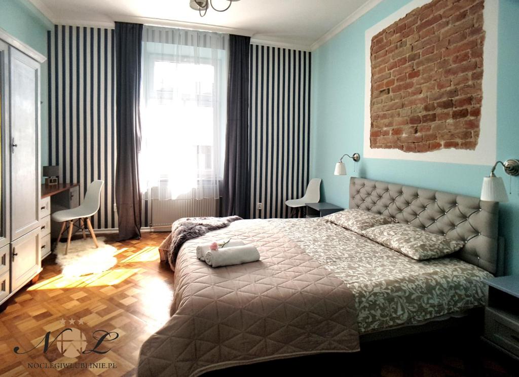 Posteľ alebo postele v izbe v ubytovaní Apartament Peowiaków Superior