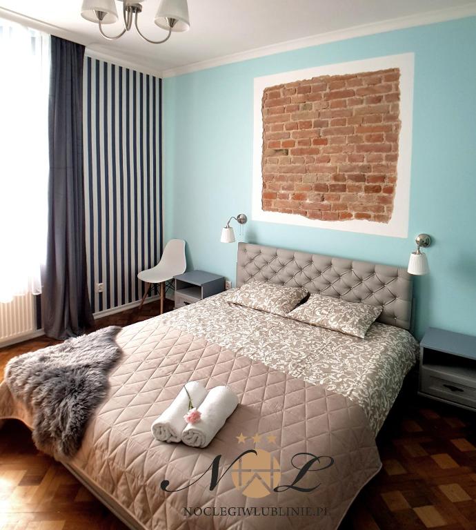 Posteľ alebo postele v izbe v ubytovaní Apartament Peowiaków Superior