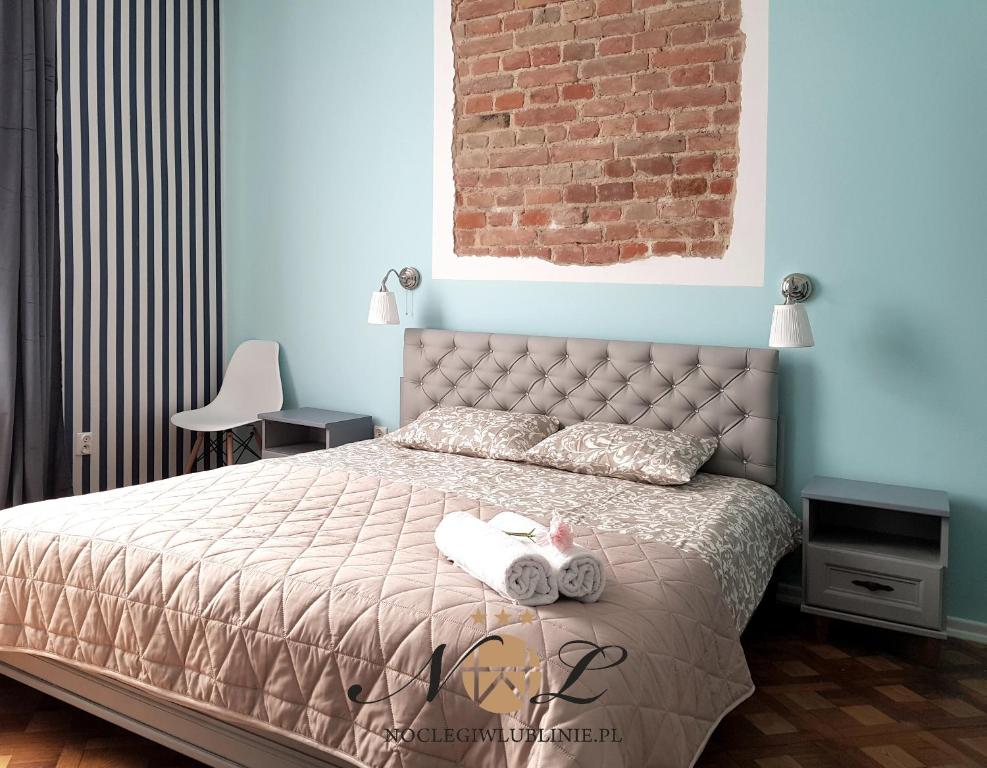 Posteľ alebo postele v izbe v ubytovaní Apartament Peowiaków Superior