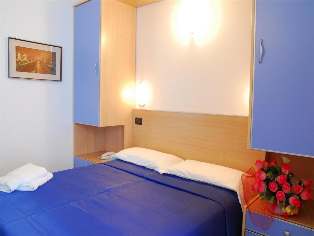 Postel nebo postele na pokoji v ubytování Hotel Veliero