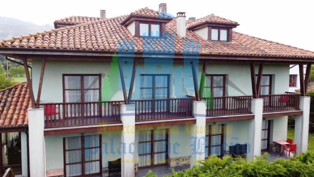 a building with windows and balconies on it at Apartamentos Palacio Bueño in Colunga